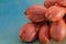 Macro of onions. Shallots on a green wooden table. Shallow depth of field. Top view. Copy space