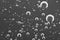 Macro Oxygen bubbles in water on black white background