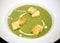 Macro photo of bright tasty cream spinach soup