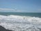 Macro photo with decorative background of beautiful sea perspective with white scallops of foam and blue sky