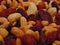 Macro photo with a decorative background of delicious healthy dried fruits and nuts on the counter of a European store