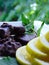 Macro photo with a decorative background of a delicious still life with yellow lemon, mint chocolates and a leaf of natural mint