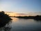 Macro photo with decorative background of rural sunset landscape on the river in beautiful gentle evening shades of light