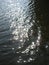 Macro photo with a decorative background of sunbeams on the water of a rural river