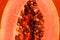 Macro photo of an exotic papaya fruit. Papaya seeds.