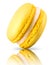 Macro photo of french yellow macaroon isolated on white background