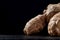 Macro photo. ginger root on a black background. side view. volume ripe product. macro photo. Against viruses and diseases