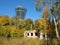 Macro photo with a landscape background of a modern high-rise building and old ruins in a European city park for design