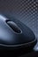 macro photo. Single wireless computer mouse on a dark gray background