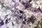 macro photo of sparkling crystals of white, magenta and violet amethyst, semi precious minerals,