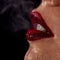 Macro photo of wet woman\'s lips with smoke on background