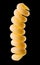 Macro photo of yellow fusilli pasta isolated on black with clipping path