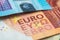 Macro photograph of the word euro on a euro banknote