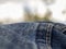 Macro photography of the folds of a pair of jeans