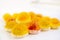 Macro photography of jelly-like craft marmalade with orange juice. The sweetness of yellow and orange jelly candies on a light