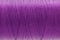 Macro picture of thread texture violet color background