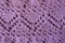 Macro of pink handmade zigzag knitted openwork
