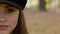 Macro portrait of young girl looking into camera. One part of face on background