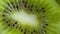 Macro rotation video shooting of slice kiwi fruit .Close up flesh of kiwi.