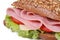 Macro sandwich with ham, cheese, tomatoes and lettuce isolated