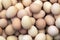 Macro shoot of brown / white  eggs at hay nest in chicken farm