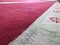 Macro shoot of red and gray rug on a mosque