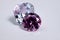 Macro shoots of pink color round shaped shiny diamond 