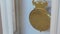 Macro shot of an antique vintage clock with a pendulum in motion