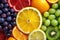 macro shot of assorted vitamins with colorful fruits