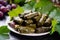 Macro shot of beautifully arranged stuffed grape leaves with tantalizing filling spilling out onto a plate surrounded by vibrant