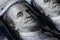 Macro shot of a brand new one hundred dollar bill showing the face of Benjamin Franklin.