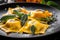 Macro shot of colorful ravioli stuffed with pumpkin and served with sage butter sauce and Parmesan cheese shavings