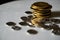 Macro shot detail of golden and silver color coin stacks on dark background with copy space for text. Business and finance growth