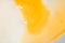 Macro shot of egg yolk of cracked egg. Cooking recipe made from eggs.