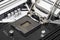 Macro shot of empty modern LGA 1200 socket for CPU on black desktop motherboard.