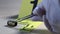 Macro shot of forensic csi police officer collecting bullet casing as evidence on crime scene