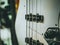 Macro shot of four strings electric bass guitar