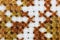 Macro shot fragment embroidery pattern brown thread handmade embroidery, pattern in cross-stitch style on white fabric