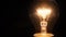 Macro shot of the glowing filament of an incandescent tungsten lightbulb