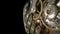 Macro shot of gold internal parts of antique pocket watch. Clockwork with rotating spring, gears, cogwheel and wheels