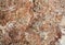 Macro shot of granite or marble stone structure with brown white marbling and spots. Marble stone surface with texture