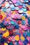 macro shot of multicolored confetti with glittery texture