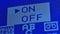 Macro shot of an old analog TV screen. Analogue retro TV settings menu in extreme close up. Blue pixel background. Retro