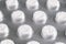 Macro shot pile of tablets pill in blister packaging. Silver aluminium foil blister pack. Pharmaceutical industry. Pharmacy