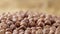Macro shot of the rotating peeled hazelnuts. Dried brown hazel kernels close up. Organic healthy food background. Slow