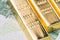 Macro shot of shiny bullion ingot gold bar on Euro banknote using as wealth investment or investment