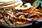 Macro shot of sizzling Fajitas with a mix of marinated steak and chicken, grilled onions, colorful bell peppers,