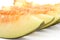 Macro shot of slice Canary melon on white