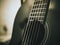 Macro shot of strings of classical acoustic guitar