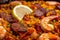 Macro shot of a tantalizing Paella with a mix of chorizo, chicken, and shrimp arranged in a beautiful and colorful pattern